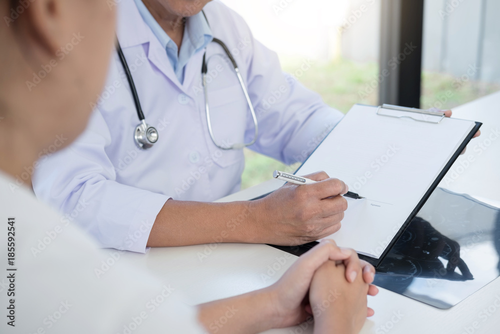 Professor Doctor presenting report and recommend a method with patient treatment, after results on brain x-ray film About the problem of the patient Professor Doctor presenting report and recommend a method with patient treatment, after results on brain x-ray film About the problem of the patient