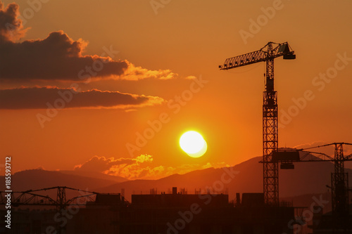 Sunset on the city's construction sites