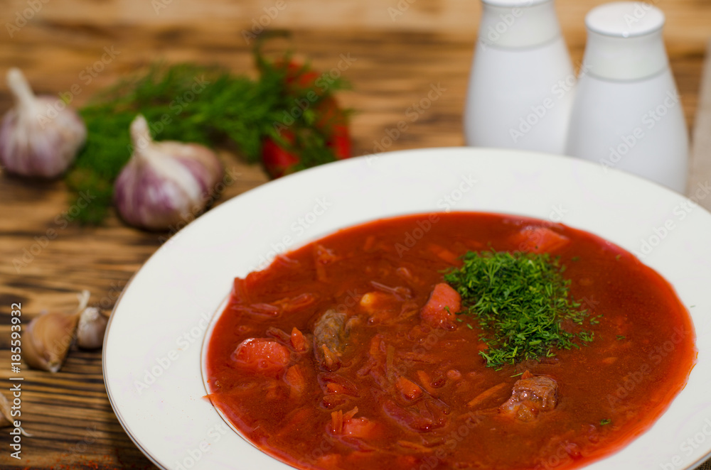 Russian borsch with meat and sour cream on the table Russian borsch with meat and sour cream on the table