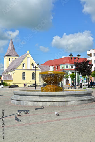 GVARDEYSK, RUSSIA. The fountain and St. John the Baptist Church at Victory Square photo