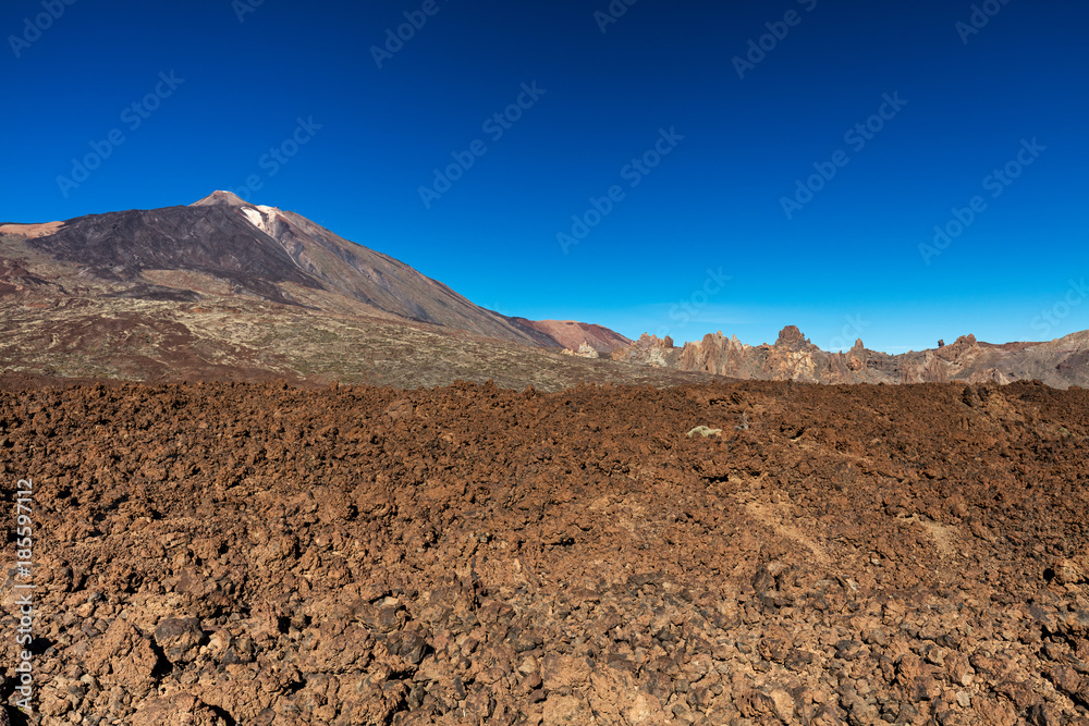 Teide National Park, Tenerife, Canary Islands - colourful soil of the Montana Blanca volcanic ascent trail. This scenic hiking path leads up to the 3718 m Teide Peak, the highest peak in Spain
