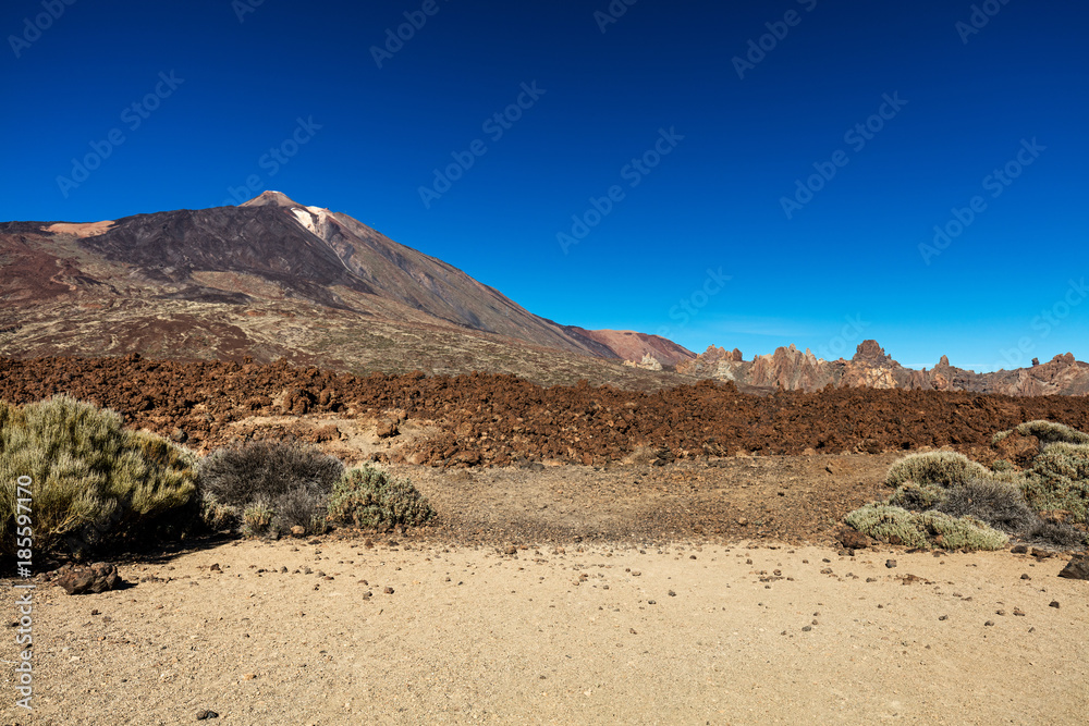 Teide National Park, Tenerife, Canary Islands - colourful soil of the Montana Blanca volcanic ascent trail. This scenic hiking path leads up to the 3718 m Teide Peak, the highest peak in Spain