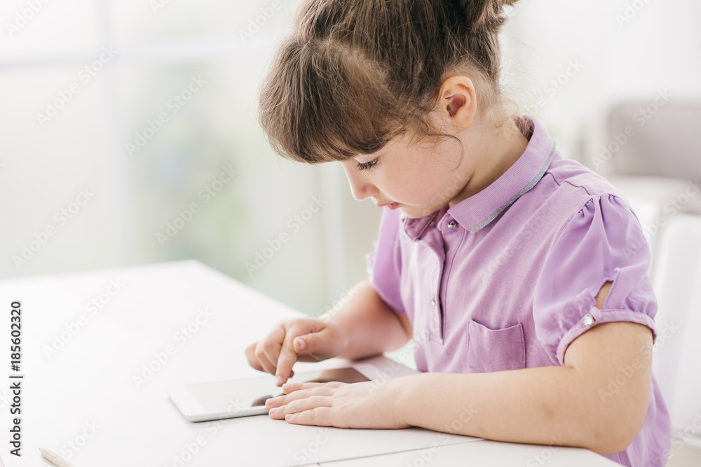Cute girl using a digital tablet Cute girl using a digital tablet