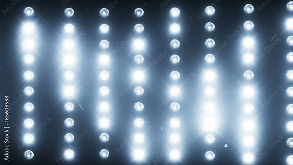A wall of light projectors, a flash of light
