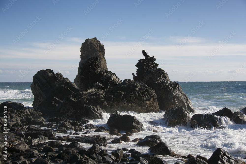 waves crashing on the rocks at Acitrezza in Sicily waves crashing on the rocks at Acitrezza in Sicily