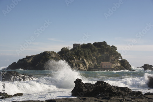 waves crashing on the rocks at Acitrezza in Sicily