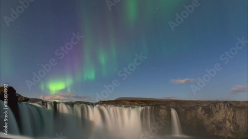 ICELAND –  2016 : Timelapse of amazing Northern Lights at Gódafoss waterfall at night with beautiful landscape in view
