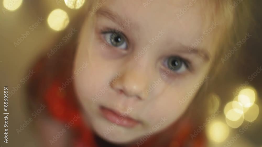 Funny little girl looking at camera and smiling Funny little girl looking at camera and smiling