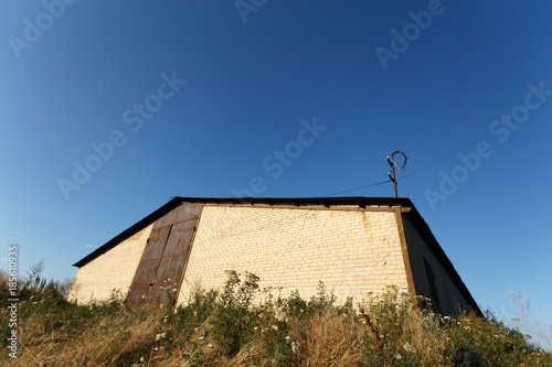 Brick barn under the blue sky photo