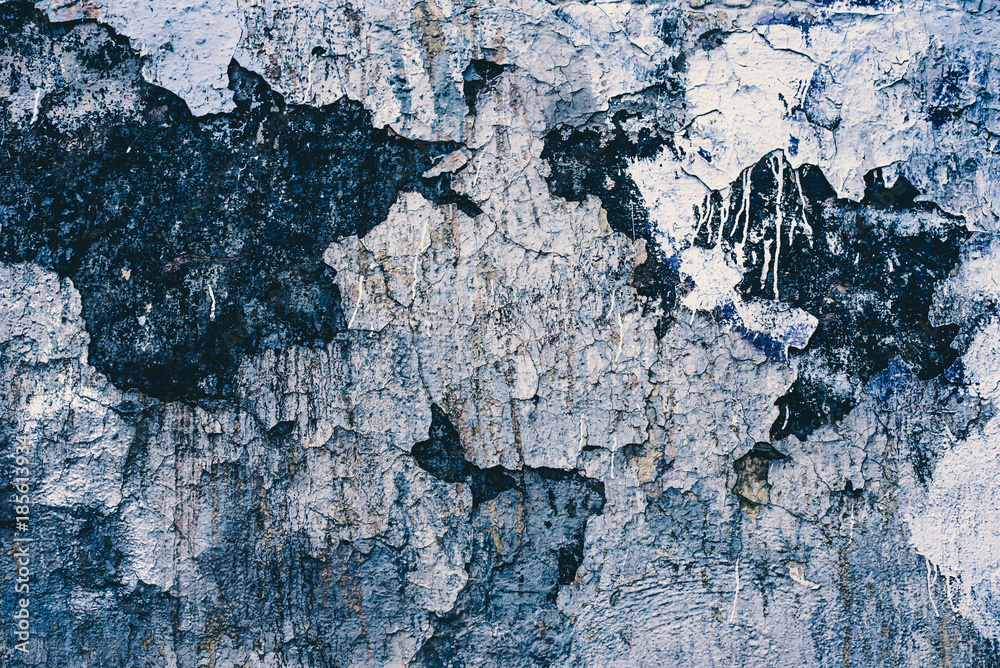 Fototapeta premium Old dark wall with cracked paint - vintage background
