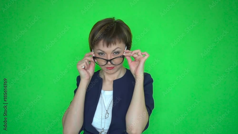 Female teacher with pointer is dancing on green screen background Female teacher with pointer is dancing on green screen background