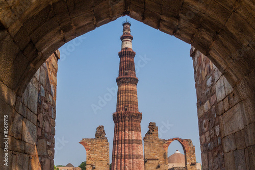 View of Qutub Minar minaret through a gate. Delhi, India. photo
