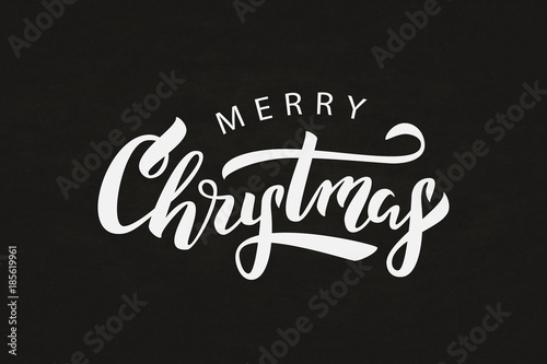 Vector isolated lettering for Merry Christmas for decoration and covering on the chalk background.