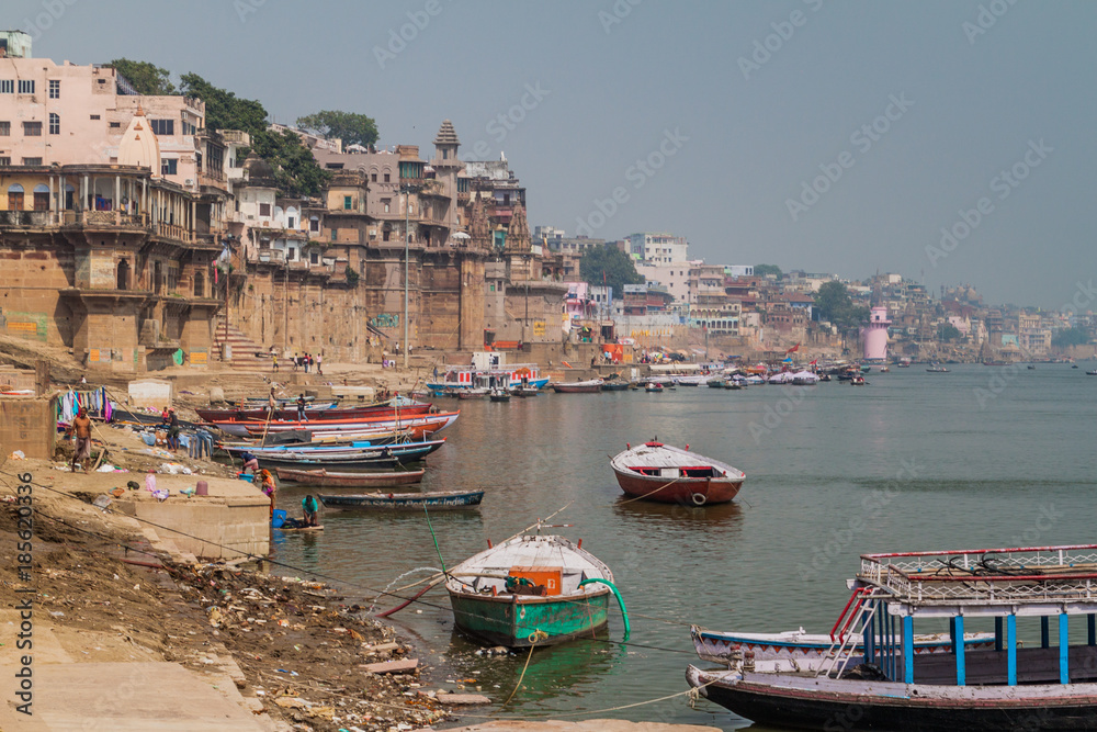 VARANASI, INDIA - OCTOBER 25, 2016: View of Ghats (riverfront steps) leading to the banks of the River Ganges in Varanasi, India