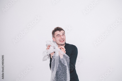 boy squeezing bubble wrap