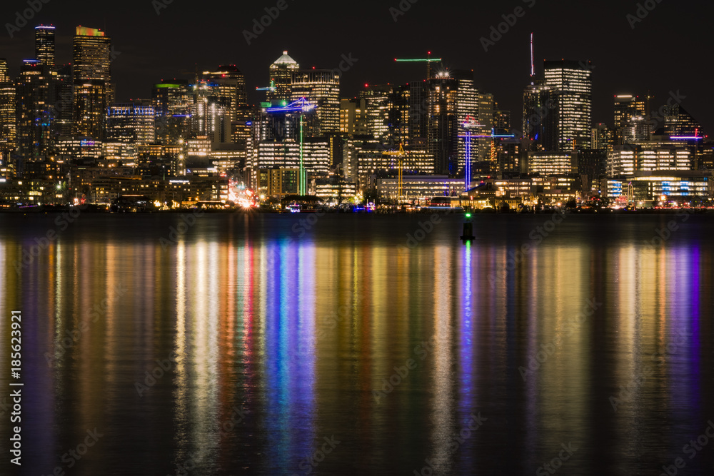 Seattle skyline at night reflecting in Lake Washington