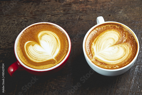 Two cups of coffee on wooden