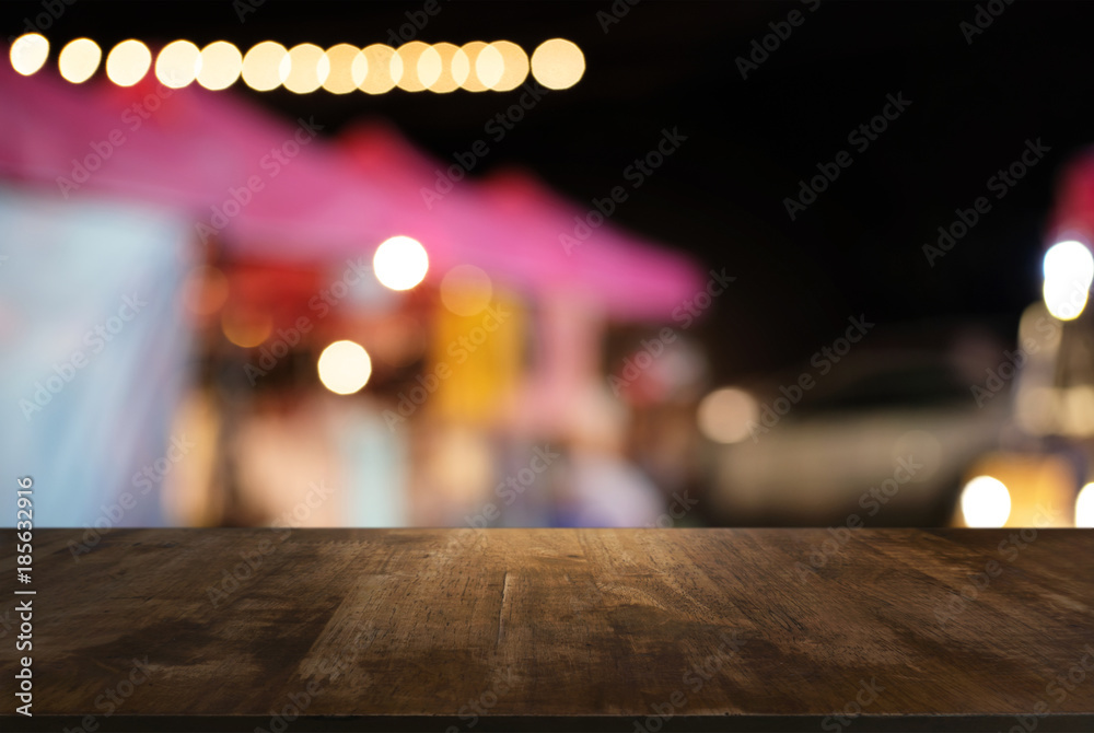 Empty wooden table in front of abstract blurred background of coffee shop . can be used for display or montage your products.Mock up for display of product Empty wooden table in front of abstract blurred background of coffee shop . can be used for display or montage your products.Mock up for display of product