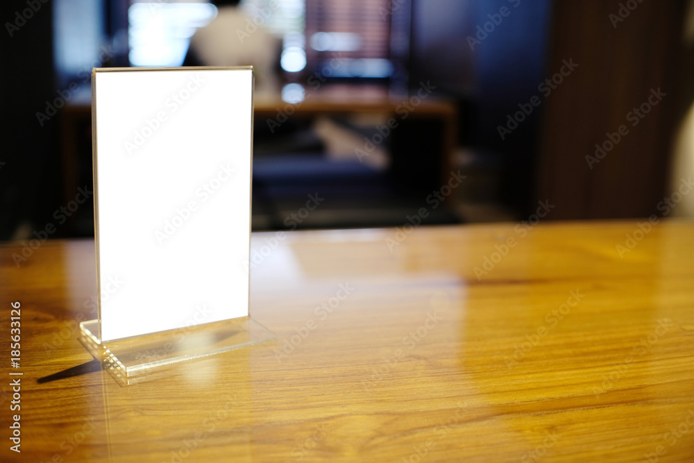 Mock up Menu frame standing on wood table in Bar restaurant cafe. space for text. Mock up Menu frame standing on wood table in Bar restaurant cafe. space for text.