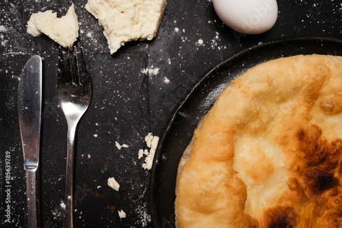 nourishing imeretian khachapuri recipe. fatty delicious unhealthy food. georgian cuisine photo