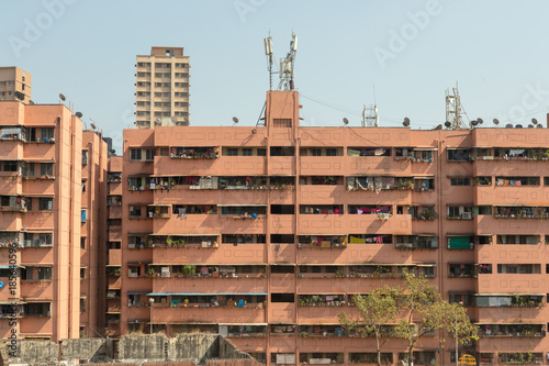 Photography Section from the exterior of an residential building, all balconies full of laun