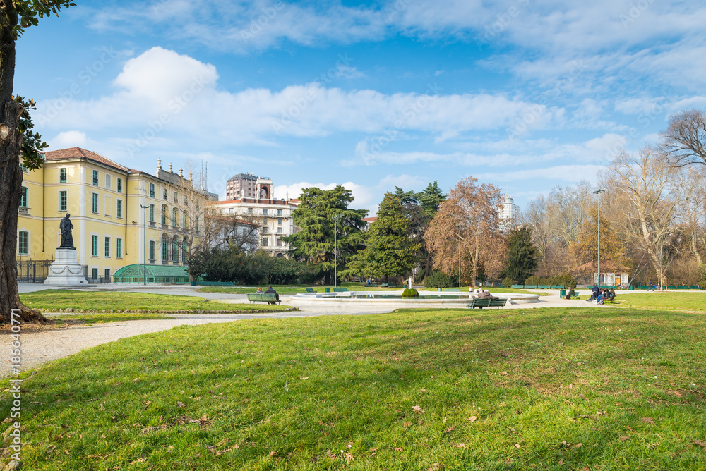 Fototapeta premium Milan, Italy. Indro Montanelli public gardens (or gardens of porta Venezia or via Palestro) in Milan city. Large urban park with the fountain of Palazzo Dugnani 