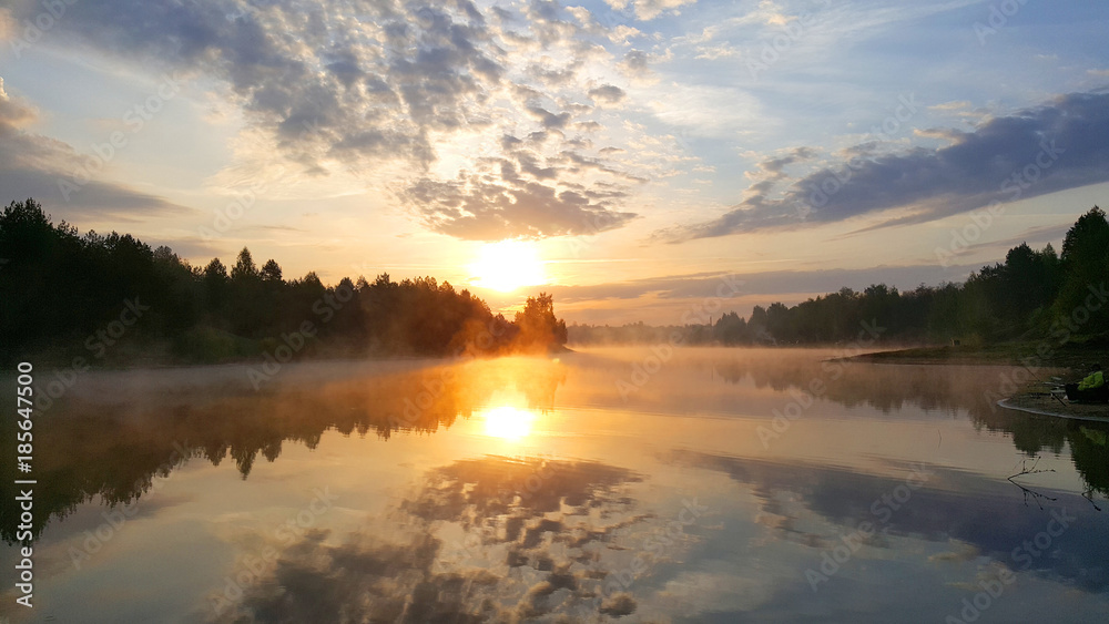 Sunrise on the forest lake