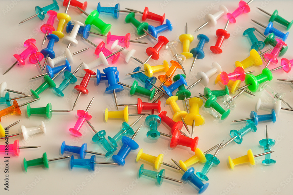 Colorful push pins displayed on a white background Colorful push pins displayed on a white background