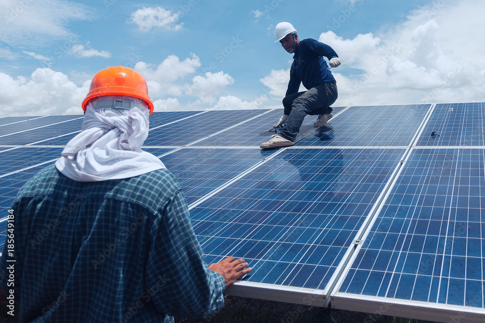 engineer team working on replacement solar panel in solar power plant;engineer and electrician team swapping and install solar panel after solar panel voltage drop. engineer team working on replacement solar panel in solar power plant;engineer and electrician team swapping and install solar panel after solar panel voltage drop.