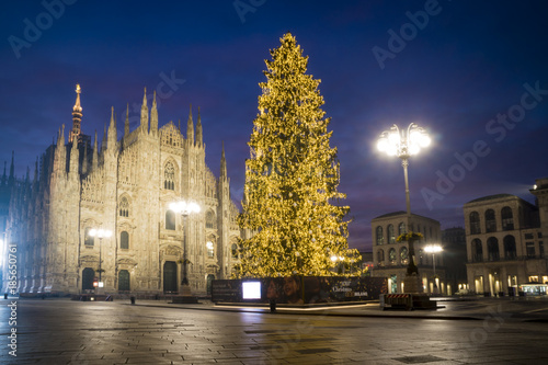 Milan, Italy: Duomo square in december with the christmas tree in front of Milan cathedral, night view.