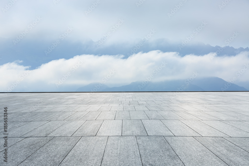 empty square floor and mountain fog landscape