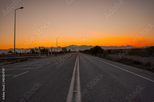 On a lonely road in sunset all alone