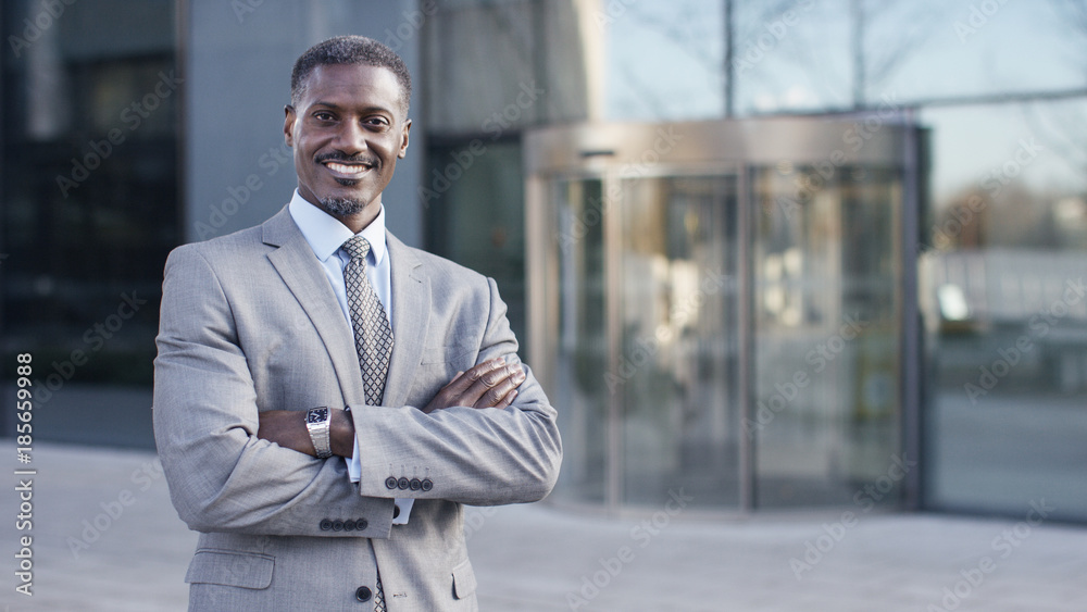Portrait of confident male business man smiling to camera, with space for text Portrait of confident male business man smiling to camera, with space for text