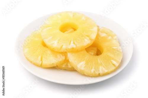 Canned pineapple slices on plate