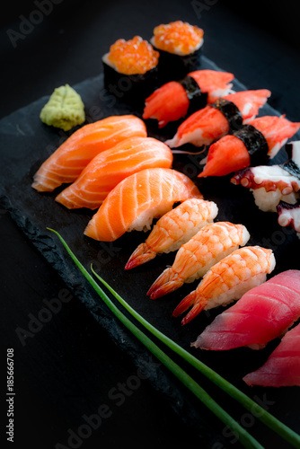 Set of Sushi & Sasimi on black stone plate photo