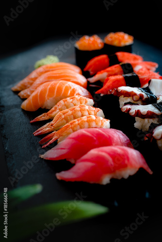 Set of Sushi & Sasimi on black stone plate © 9mot