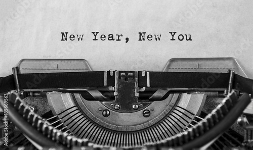 New Year New You message typed on a vintage typewriter, old paper. close-up