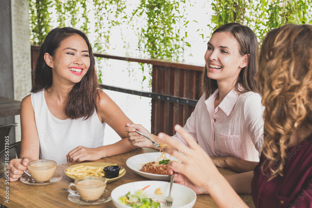 group of three best friend having fun conversation while lunch t