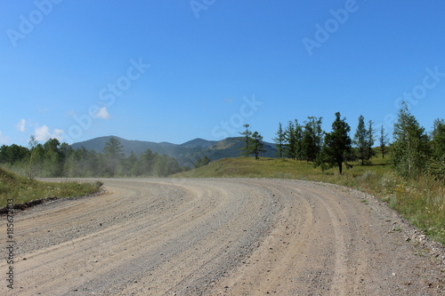 Dusty mountain road in the Republic of Khakassia