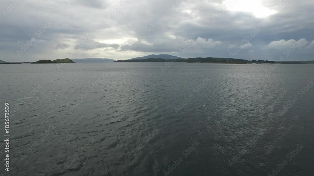 Flying over the sea at Craobh Haven with the island of Jura in the background , Scotland Flying over the sea at Craobh Haven with the island of Jura in the background , Scotland