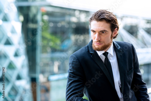 Wallpaper Mural Confident young business man in black tie portrait. Torontodigital.ca