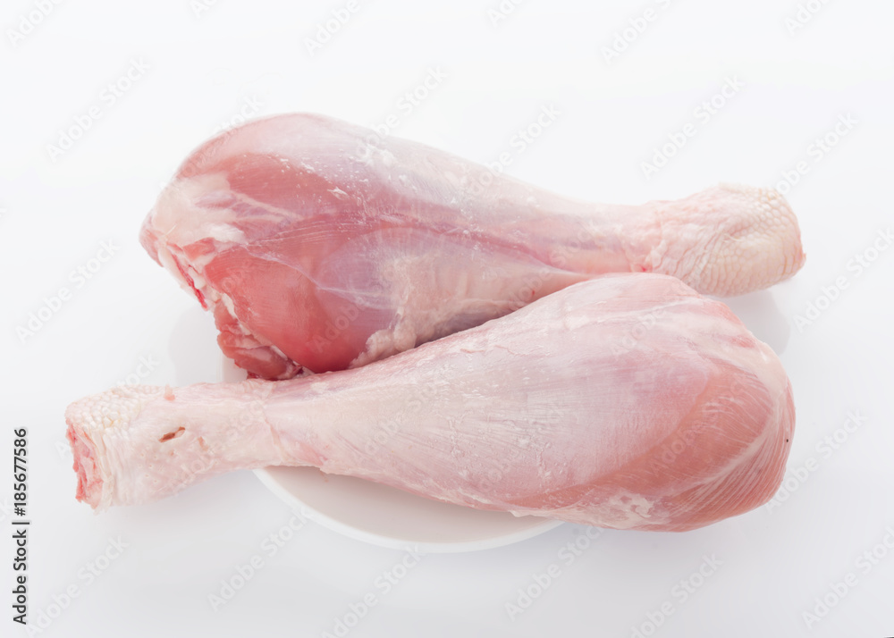 skinless turkey drumsticks isolated on white