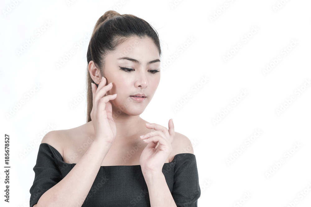 Beauty woman portrait. Portrait of a beautiful young Chinese Asian Oriental woman isolated in white. Touching her face, studio shot. Beauty woman portrait. Portrait of a beautiful young Chinese Asian Oriental woman isolated in white. Touching her face, studio shot.