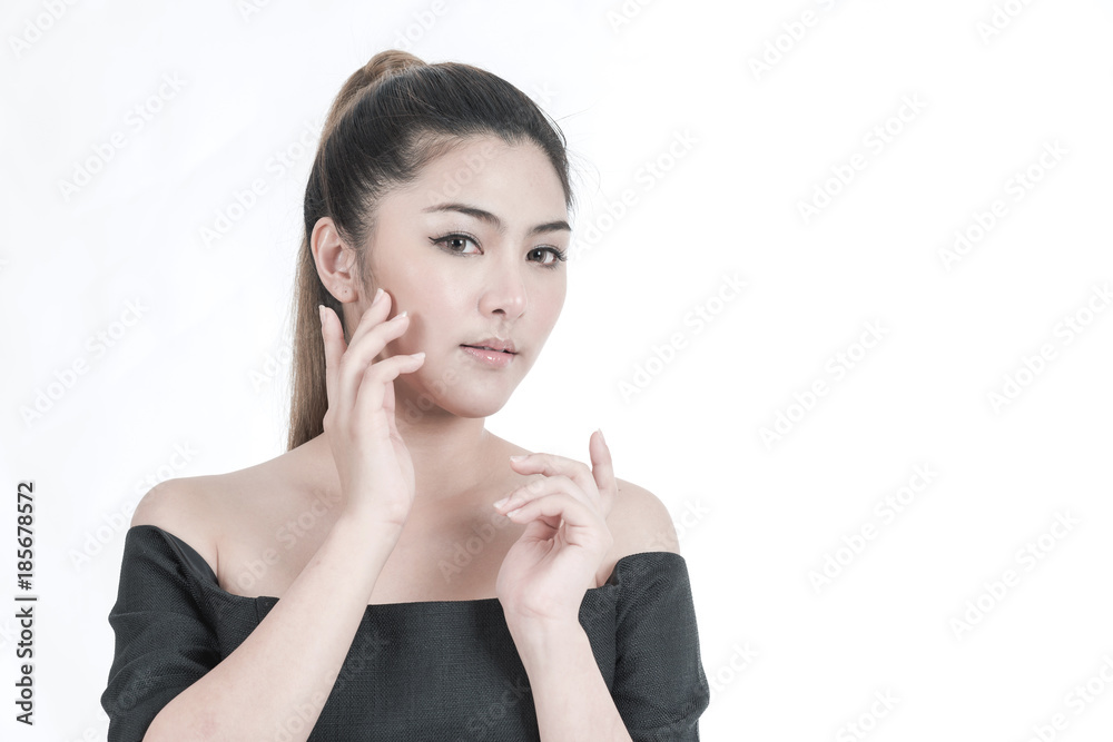 Beauty woman portrait. Portrait of a beautiful young Chinese Asian Oriental woman isolated in white. Touching her face, studio shot. Beauty woman portrait. Portrait of a beautiful young Chinese Asian Oriental woman isolated in white. Touching her face, studio shot.