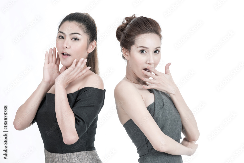 Beauty women surprise shock concept. Portrait of two beautiful young Chinese Asian Oriental women isolated in white. Posing surprise and shock face, studio shot.