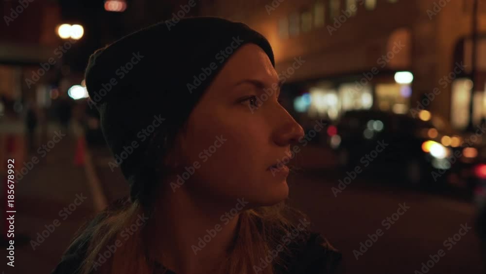 gimbal shot of teen girl standing on street of Chinatown in San Francisco at night gimbal shot of teen girl standing on street of Chinatown in San Francisco at night