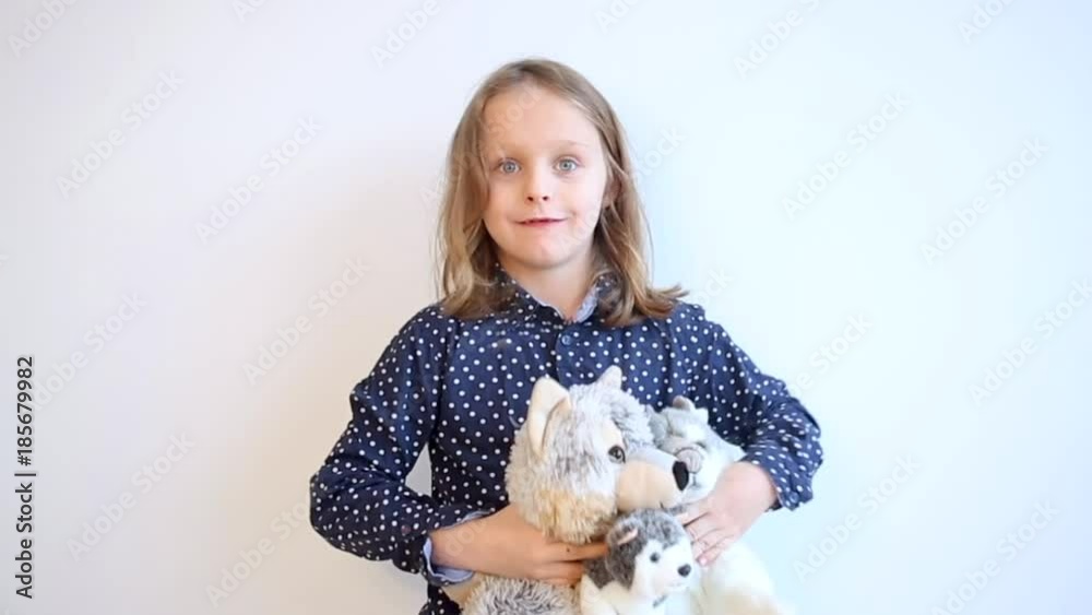 Cinemagraph of boy holding stuffed animals

