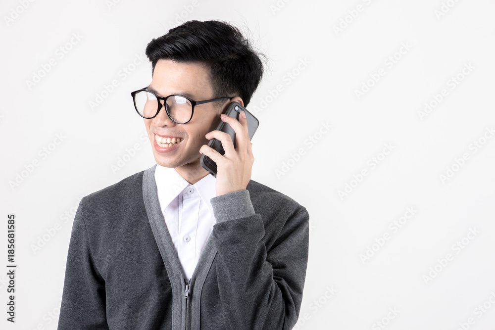 Confident young business woman in smart office dress on phone.