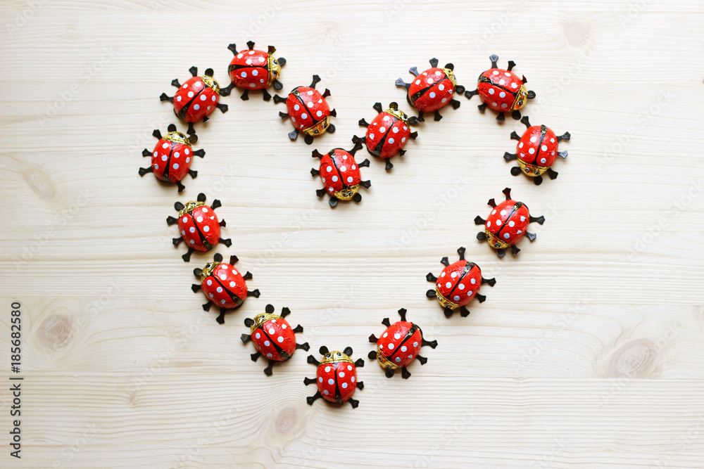 heart formed with chocolate ladybugs on bright wood heart formed with chocolate ladybugs on bright wood