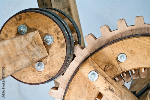 historical gears in wood and metal with wheels and teeth